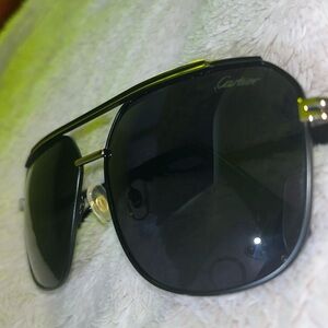 Cartier black UV sunglasses never worn gold trim and gold detailing